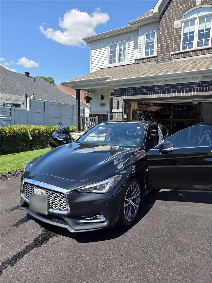Black Infiniti coupe shining in the sun
